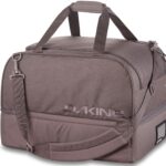 Dakine Boot Locker duffel-style boot bag with shoulder strap and top handles on a white background.