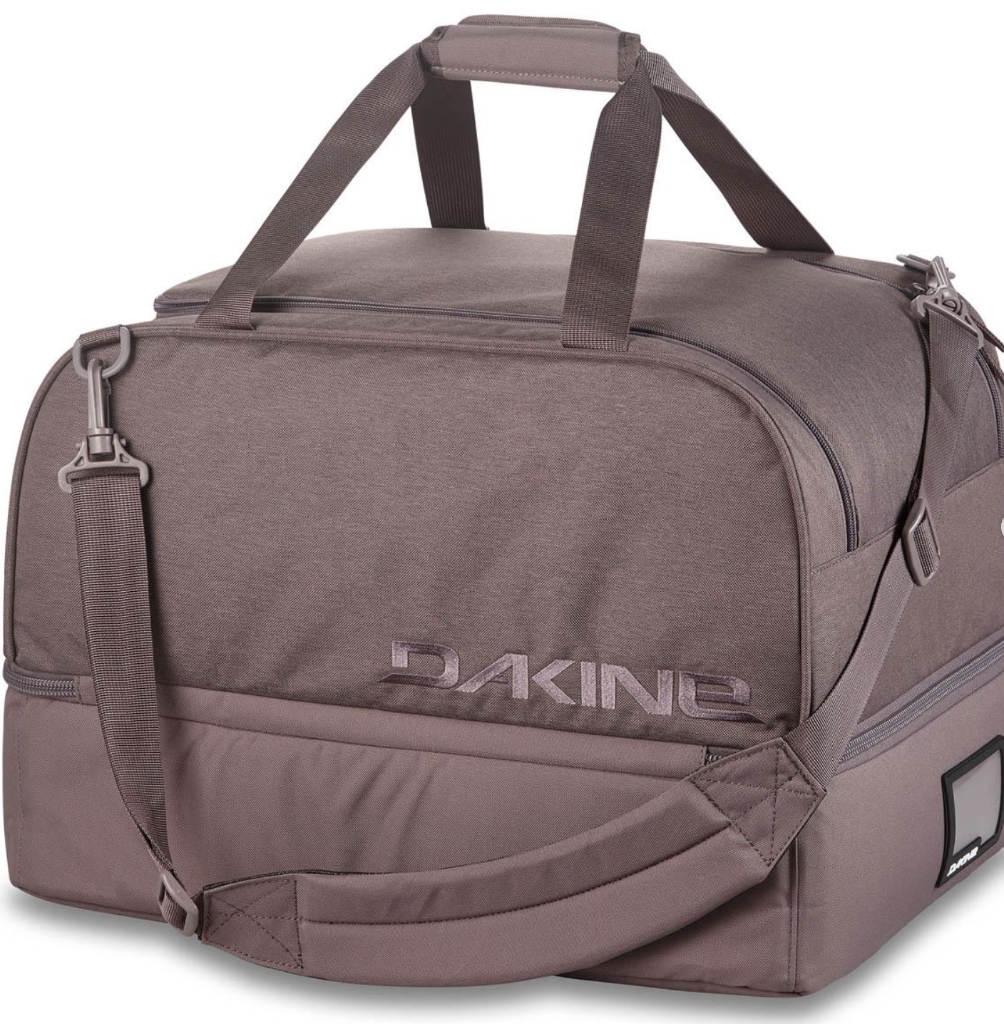 Dakine Boot Locker duffel-style boot bag with shoulder strap and top handles on a white background.